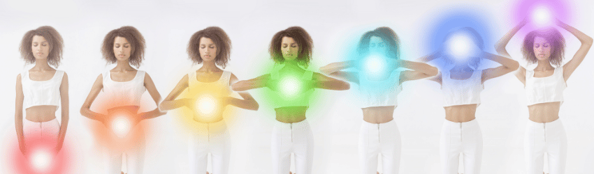 A woman's image is repeated and she holds balls of light to show where each of the 7 chakras are located.