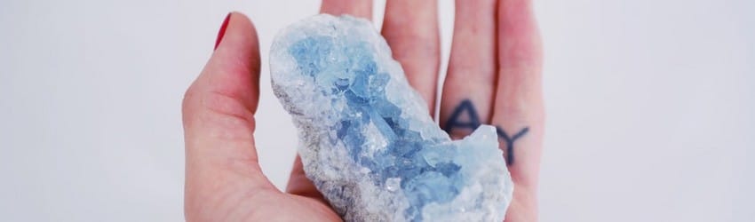 hand-holding-a-blue-crystal