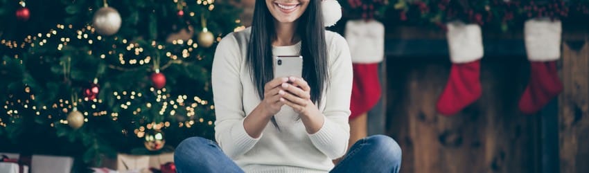 woman-on-video-call-christmas-tree-in-background