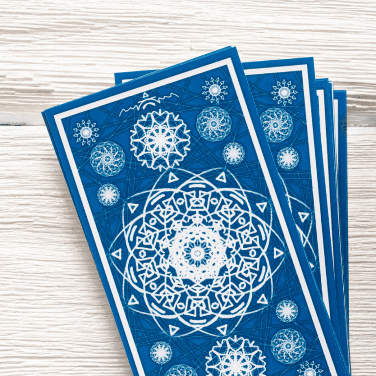 A stack of blue Tarot cards on a light background.