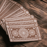 A spread of brown Tarot cards on a wooden table.